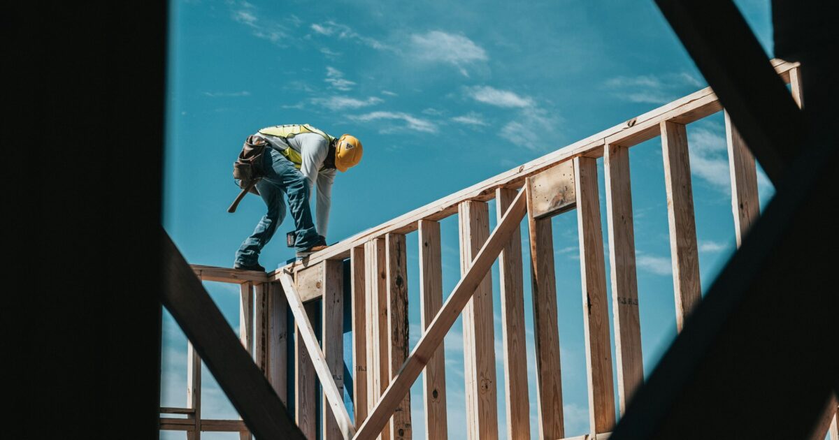 Construction team using tablets connected through temporary construction site internet solutions.